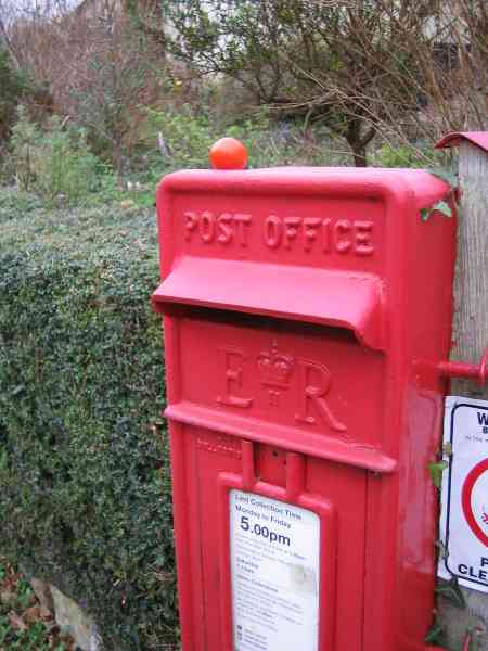 South Tawton post box with tomato on top